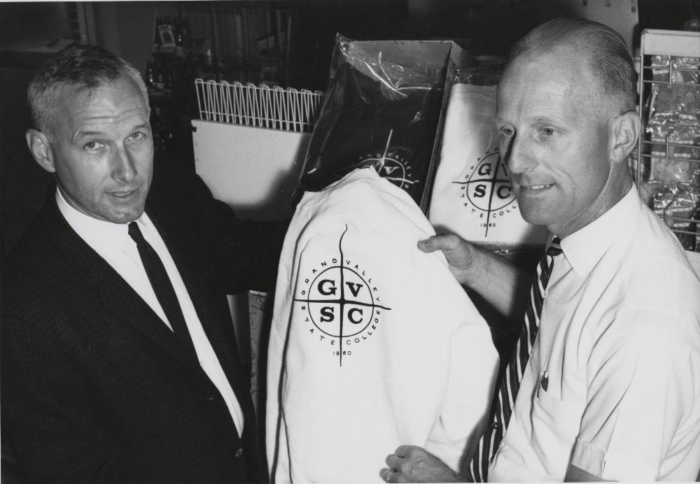 1960's holding up GVSC shirt